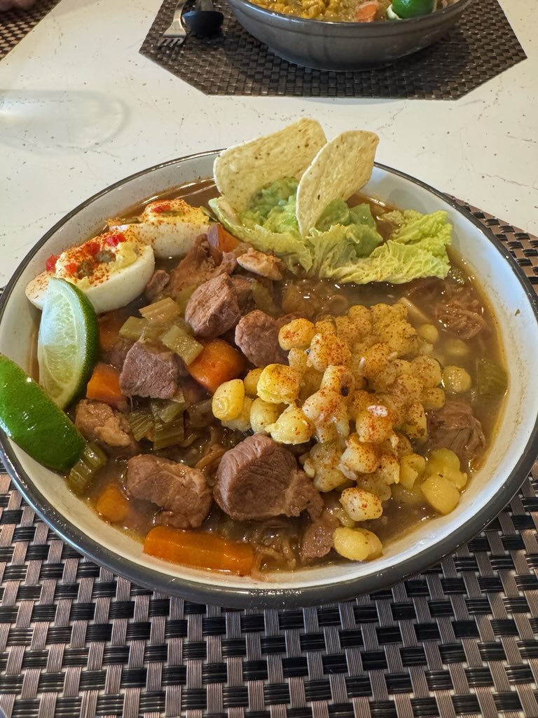 Overhead view of house ramen bowl with pork, carrots and seasoned egg